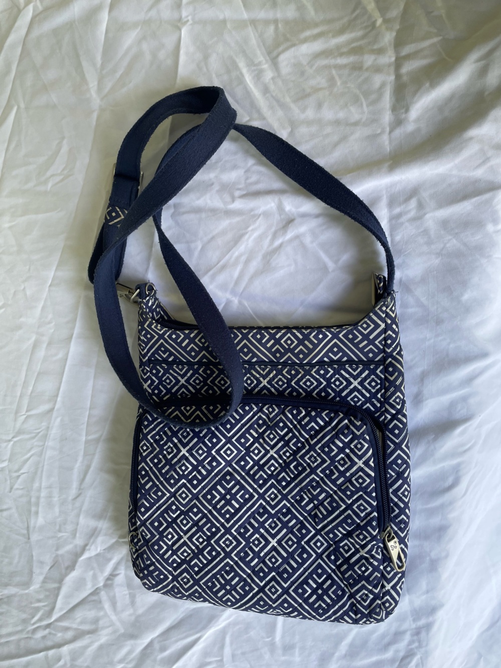 Blue fabric Travelon hobo crossbody bag.